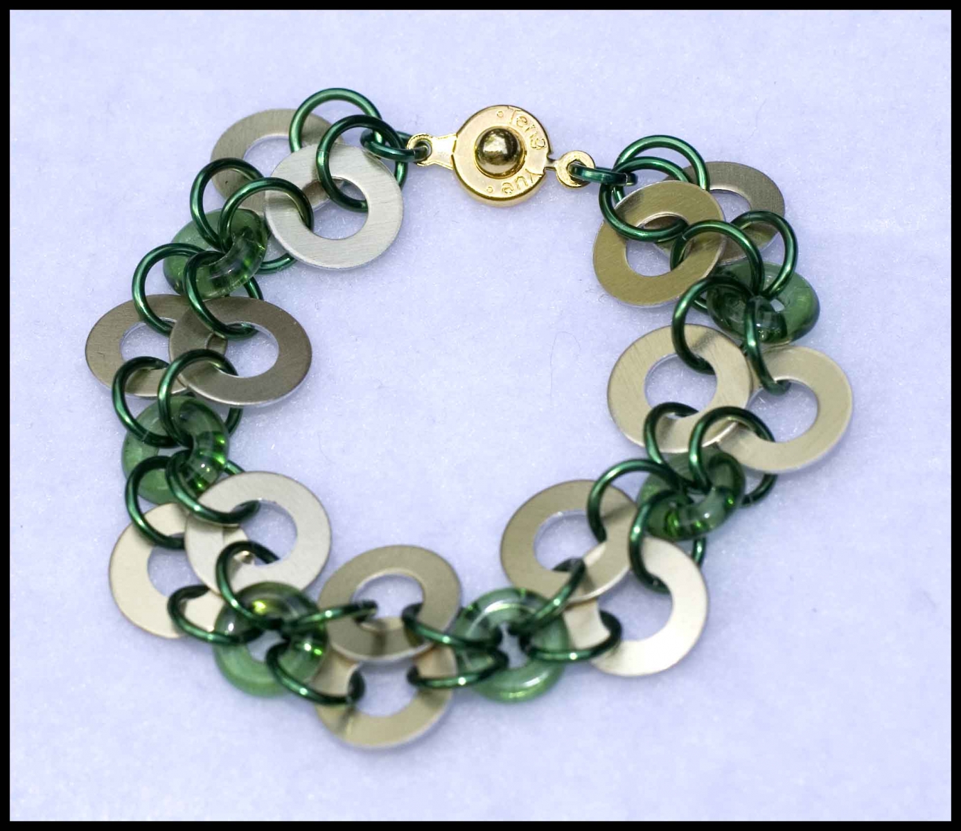 Round scales and green donut beads
